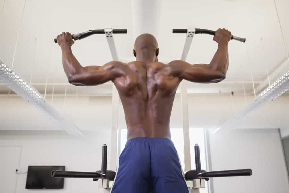 Man working out on a free-standing pull-up bar